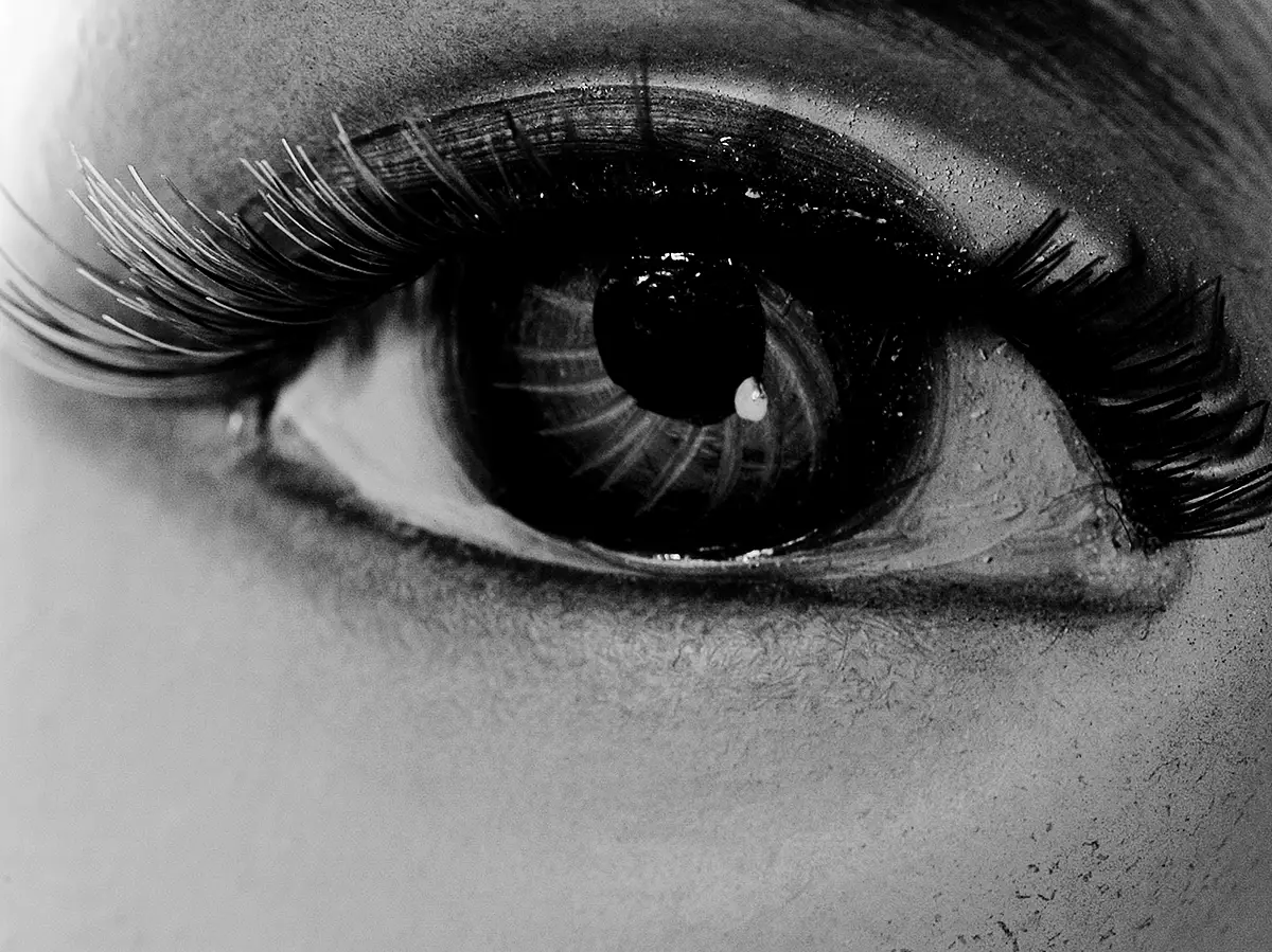 a black and white image of an eye, autoportrait by artist Julianne Rose