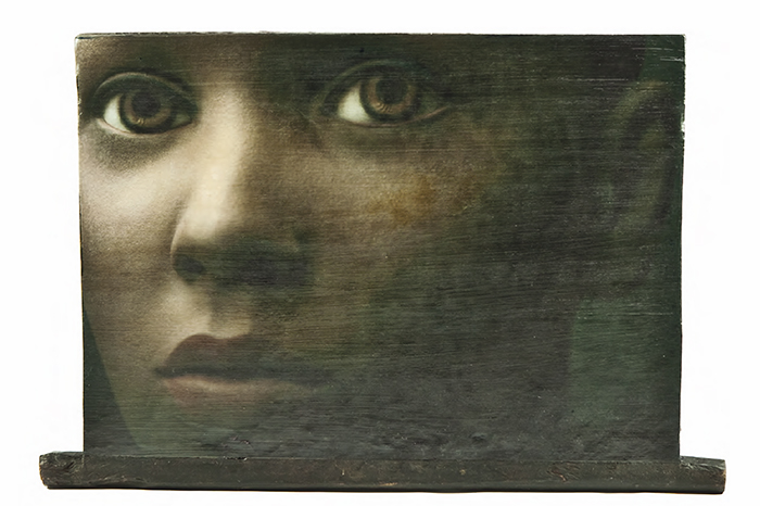 Portrait photograph printed on ancient wooden door for the project Artist Angels for Madagascar auctioned by Christie's in Paris