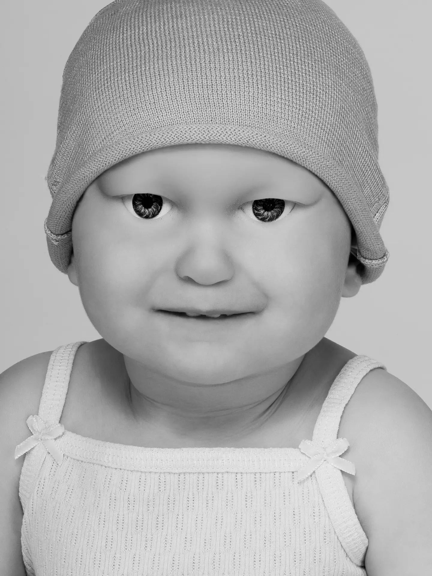Black and white portrait of a hybrid baby from the project BetaBabies-CryptoKids-Techno Teens by artist Julianne Rose